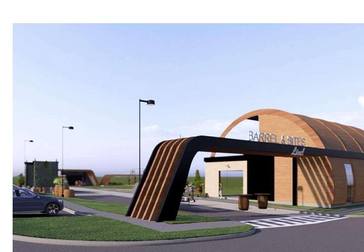 Northwest view showing the curved-portal entry sign and main building